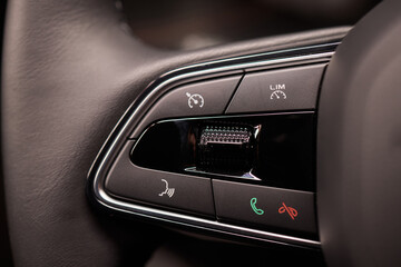 The modern cars steering wheel control panel boosts convenience and performance