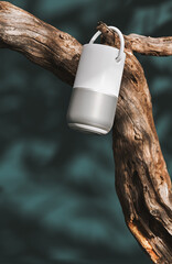 Bluetooth white speaker hanging on dry abstract tree. 3D Rendering, 3D Illustration	
