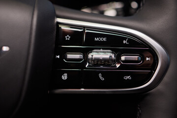 The modern cars steering wheel control panel boosts convenience and performance