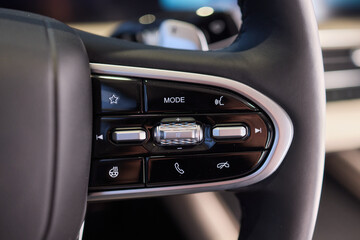 The modern cars steering wheel control panel boosts convenience and performance