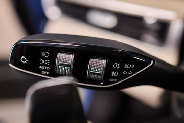 A detailed closeup view of the interior of a car, showcasing various controls and features