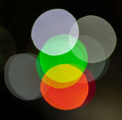 Bokeh abstract texture. Colorful blurred bright traffic lights