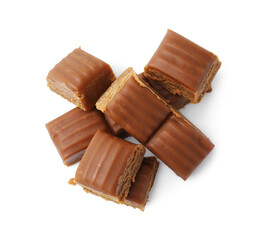 Tasty sweet caramel candies isolated on white, top view