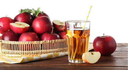 Tasty apple juice in glass and fresh fruits on wooden table against white background