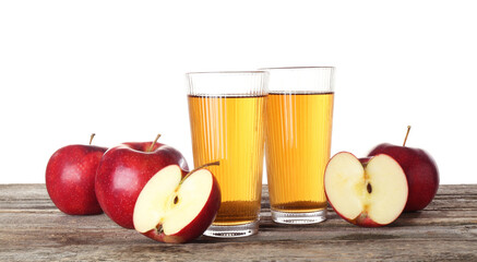 Tasty apple juice in glasses and fresh fruits on wooden table against white background