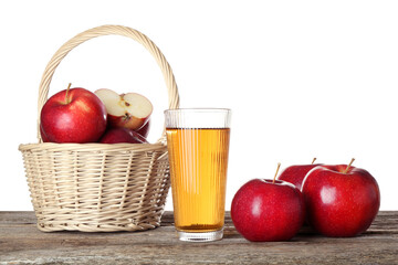 Tasty apple juice in glass and fresh fruits on wooden table against white background
