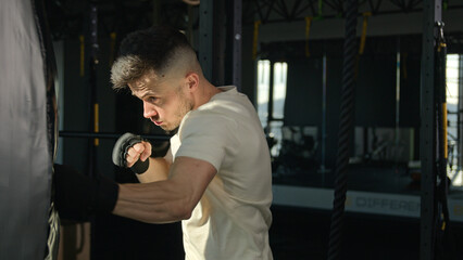 Caucasian man guy motivated male athlete fighter champion boxer sportsman training workout boxing...