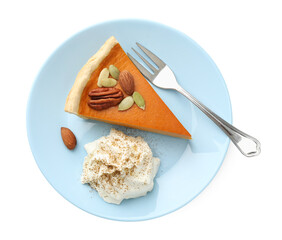 Piece of tasty homemade pumpkin pie with whipped cream, seeds and nuts isolated on white, top view