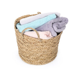 Wicker basket full of laundry isolated on white