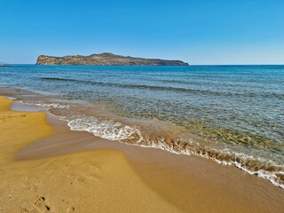 Sandy beach in Agia Marina resort on Crete. Greece, Europe.