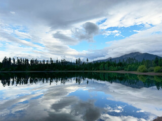 Dillion Lake in Colorado Rocky Mountains with clouds and mirror reflection