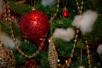 Christmas tree decoration. Merry Christmas. Happy Ney Year. Xmas holiday celebration. New Year eve. December holiday and home decoration. Decorated Xmas tree at home. Red star