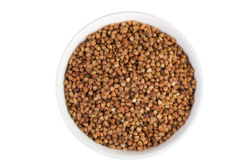 Raw buckwheat in ceramic bowl isolated on white background. Top view. Flat lay