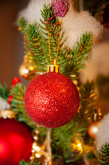 Xmas holiday celebration. New Year tree at Christmas eve. Xmas tree decoration. Santa Claus. Balls On Christmas Tree. Happy New Year. Merry Christmas. Christmas ornaments at home. Noel. Gift exchange