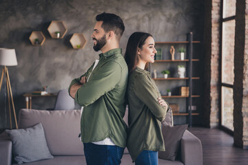 Photo of cute attractive woman man dressed casual shirts smiling arms crossed indoors house apartment room