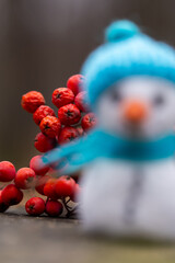 snowman toy on a blurred background , winter Christmas concept 