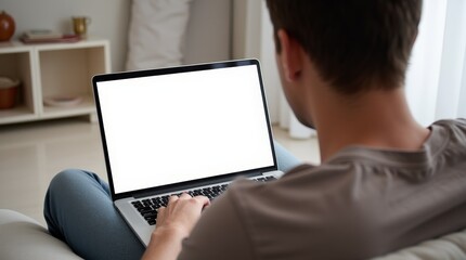 Young Man Working from Home on Laptop