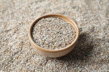 Bowl with fresh rye bran, closeup view