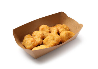 Delicious chicken nuggets in carton box isolated on white