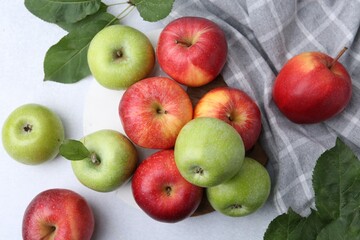 Fresh ripe apples on light grey table, top view