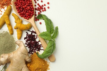 Different aromatic spices and herbs on white background, flat lay. Space for text