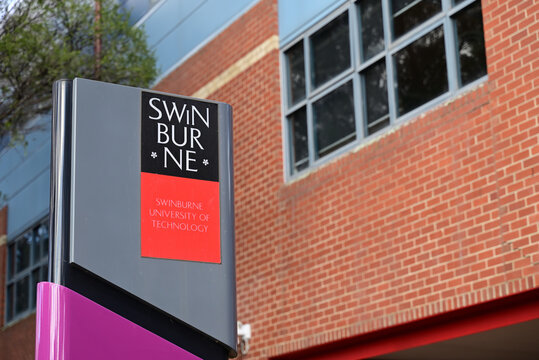 Swinburne University of Technology sign, outside a brick building at one of the university's Melbourne campuses