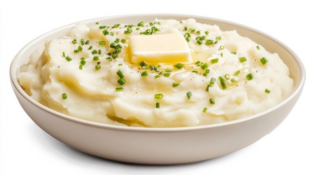 A bowl of creamy mashed potatoes topped with a pat of melting butter and a sprinkle of chives, Each spoonful offering a smooth and rich texture, A comforting side dish that's perfect for any meal
