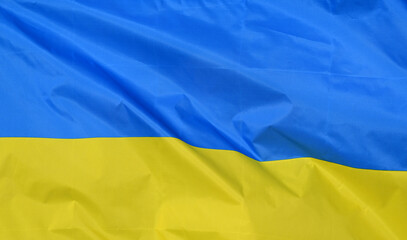 Close-up of the national flag of Ukraine, fluttering in the wind with folds, wave pattern