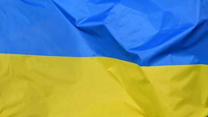 Close-up of the national flag of Ukraine, fluttering in the wind with folds, wave pattern