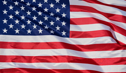 Naklejka premium Close-up of the national flag of The United States, fluttering in the wind with folds, wave pattern