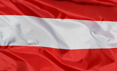 Close-up of the national flag of Austria, fluttering in the wind with folds, wave pattern