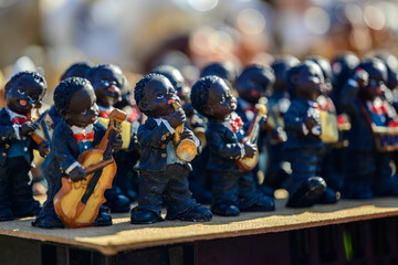 figurines of little people playing musical instruments