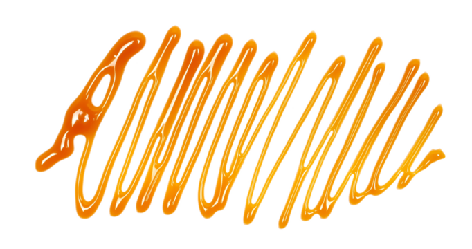 Dessert sauce, caramel flavored topping isolated on white