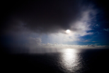 Tropical rain storm over majestic ocean, high shot