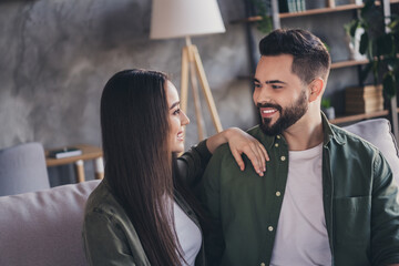Photo of two young loving people cute sweet couple enjoying time together modern loft interior apartment indoors