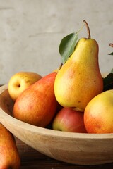 Ripe juicy pears on wooden table, closeup