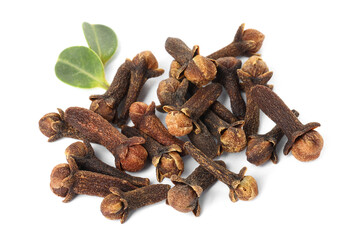 Pile of dry clove buds and green leaves on white background. Aromatic spice