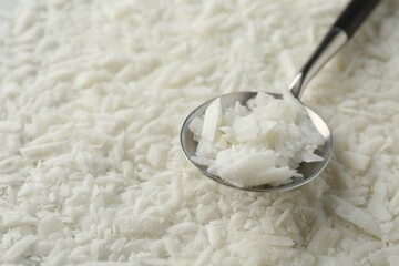 Soy wax and spoon, closeup. Space for text