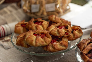 Delicious puff pastries with tomatoes filling on glass.