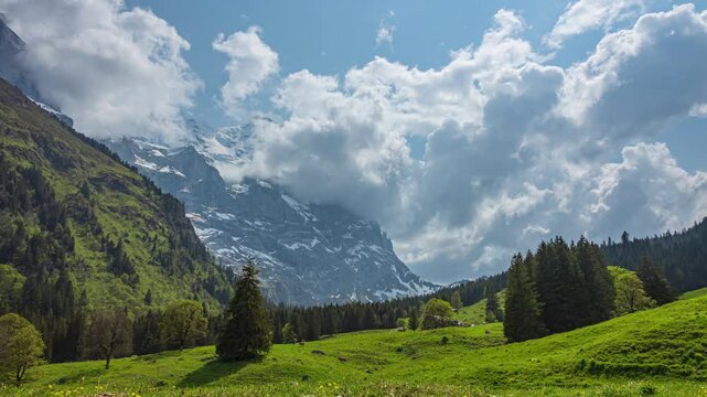 Time lapse of dancing clouds above the mountains. Mountain peak Wetterhorn. Schwarzwaldalp, Berner Oberland, Canton Bern, Switzerland