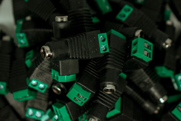 Stack of DC connectors for CCTV cameras component and installation concept, selective focus, copy space