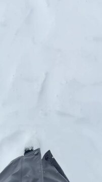 Woman walking on fresh snow