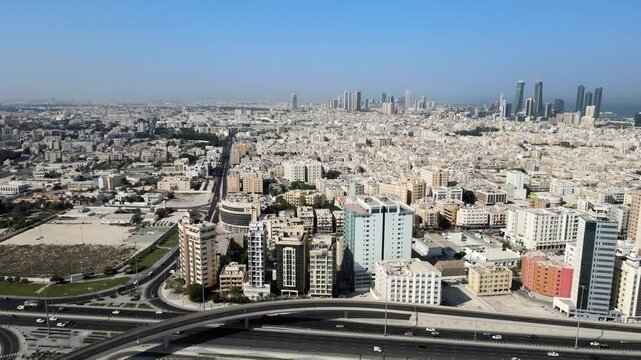 A camera drone flies sidewise along Al Fatih Highway, Manama, Bahrain