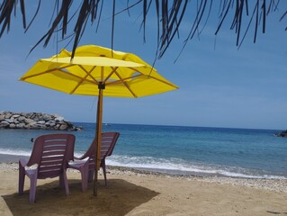 beach chairs and umbrella