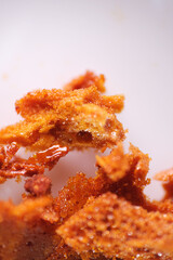 Honeycomb is a candy made out of caramelized sugar that relies on the chemical reaction of baking soda