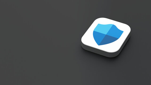 3D-rendered icon of the Microsoft Defender app logo, featuring a sleek, minimalistic design. The logo appears on a dark gray background within a white square with rounded corners.
