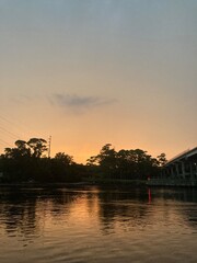 Naklejka premium sunset over the river