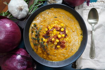  Making Butternut Bisque soup for a cozy Autumn meal. Preparing a soup for dinner from fresh vegetables from the garden.