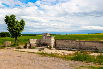 Fototapeta premium Roadside fountain between the village of Krum and the town of Dimitrovgrad in Haskovo Province, Southern Bulgaria against a beautiful spring landscape