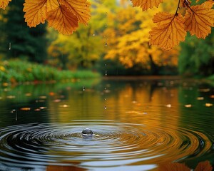 A water droplet creates ripples on a pond. This image is great for nature, tranquility, and autumn themes.
